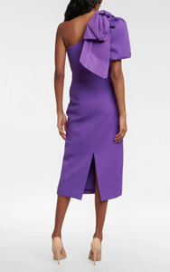 Rebecca Vallance's Rumi one-shoulder midi dress is the ultimate cocktail attire in a striking purple hue. Made to a figure-hugging fit from textured crêpe, it features a puff sleeve adorned with a label-signature taffeta bow.  RRP £485  try it. rent it. love it.  xoxo   